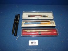 A boxed Parker ballpoint pen, Sheaffer fountain pen, Papermate, etc.