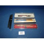 A boxed Parker ballpoint pen, Sheaffer fountain pen, Papermate, etc.