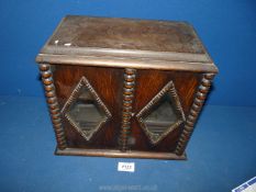 A smokers cabinet with diamond shaped glass panes and interior draw, no bowl and no key,