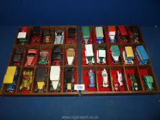 Thirty mixed vehicles in wooden divided trays including models of yesteryear,