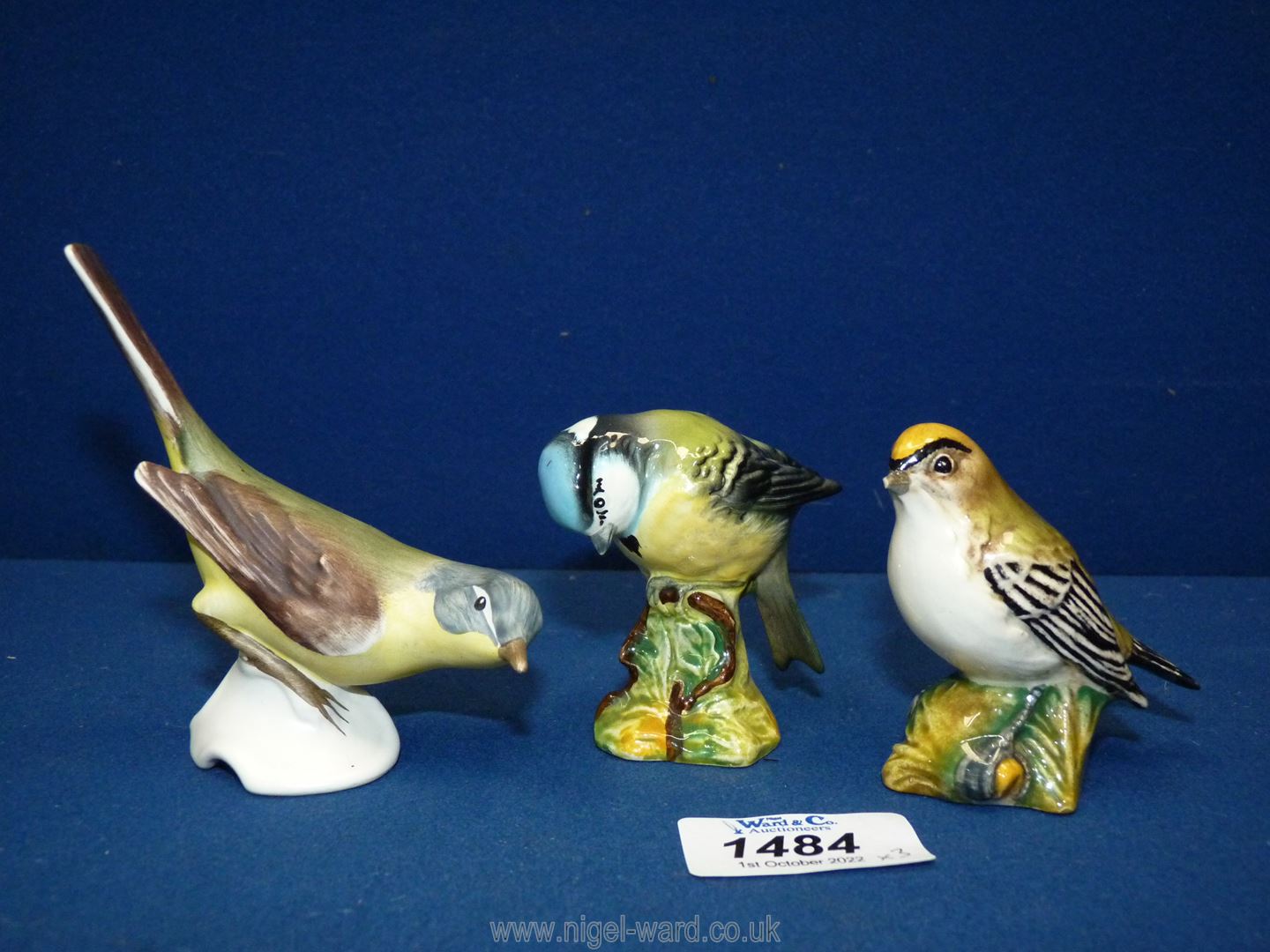 Two Beswick birds including Goldcrest (beak a/f) and Blue Tit, plus a Goebel bird.