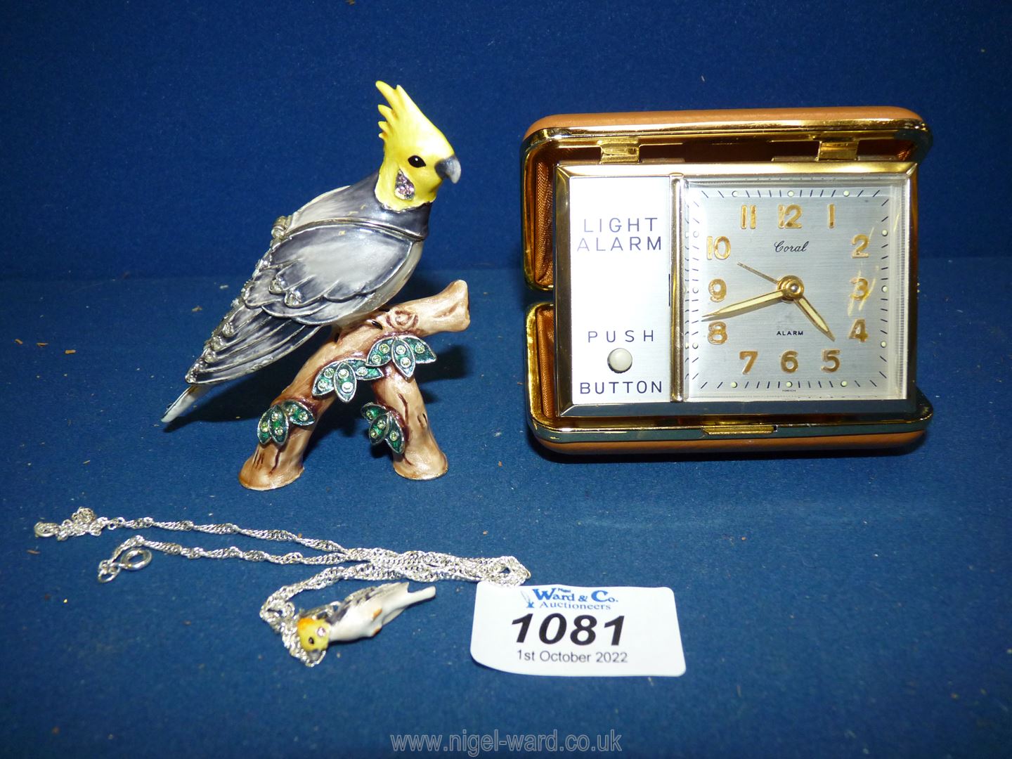 A boxed 'Hidden Treasure of Cockatoo' with miniature pendant inside head,