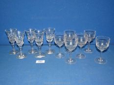 A set of six cut glass port glasses and a set of five cut glass sherry glasses, with pontil marks.