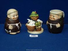 A West German Hummel figure of a boy with basket of rabbits (slight chip to base) together with a