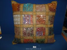 An Indian embroidered sari patchwork cushion, 24'' x 24''.