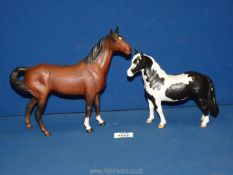 Two Royal Doulton matt finish horses, Piebald Pinto pony and a Bay with two white front socks.