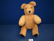 A 1960's vintage jointed teddy bear, 15 1/2" tall.
