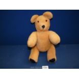 A 1960's vintage jointed teddy bear, 15 1/2" tall.