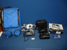 A quantity of cameras including Kodak, Technika, Panaroma, Canon Powershot in blue carrying case.