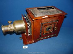 An 'Optimus' Magic lantern by Perken, Son & Co Ltd. 18 1/2" x 8".