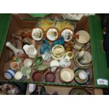 A quantity of small china ornaments including Poole seals, Wade log, Torquay pottery,