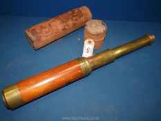 A lightwood and brass four section Telescope in a leather covered case, case in used condition,