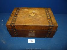 An inlaid writing Box, some wear to box and keyhole and split to base, no key. 10" x 7" x 4 1/2".
