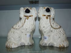 A pair of Beswick mantle spaniels with gilt locks 10" tall.