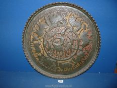 A heavy metal scalloped edge Charger, the central being decorated with animals and hunters,