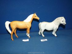 Two Royal Doulton ponies including dapple grey Shetland pony and Palomino pony.