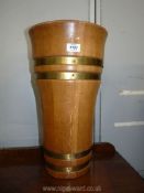 A cooper made and wood turned Umbrella/stick Stand in light oak with brushed finish brass bands,