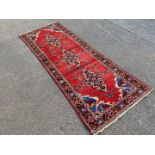 A vintage red Kerman runner.