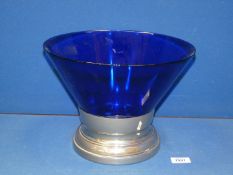 A large Bristol blue glass and white metal centrepiece, 12" diameter, 9" tall.