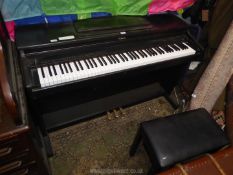 A dark Rosewood finished Roland HP237e Digital Piano having a 6 1/2 octave keyboard and complete