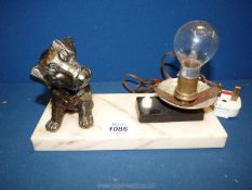 An Art Deco style desk Lamp with a marble base having a spelter terrier puppy figure (no shade),