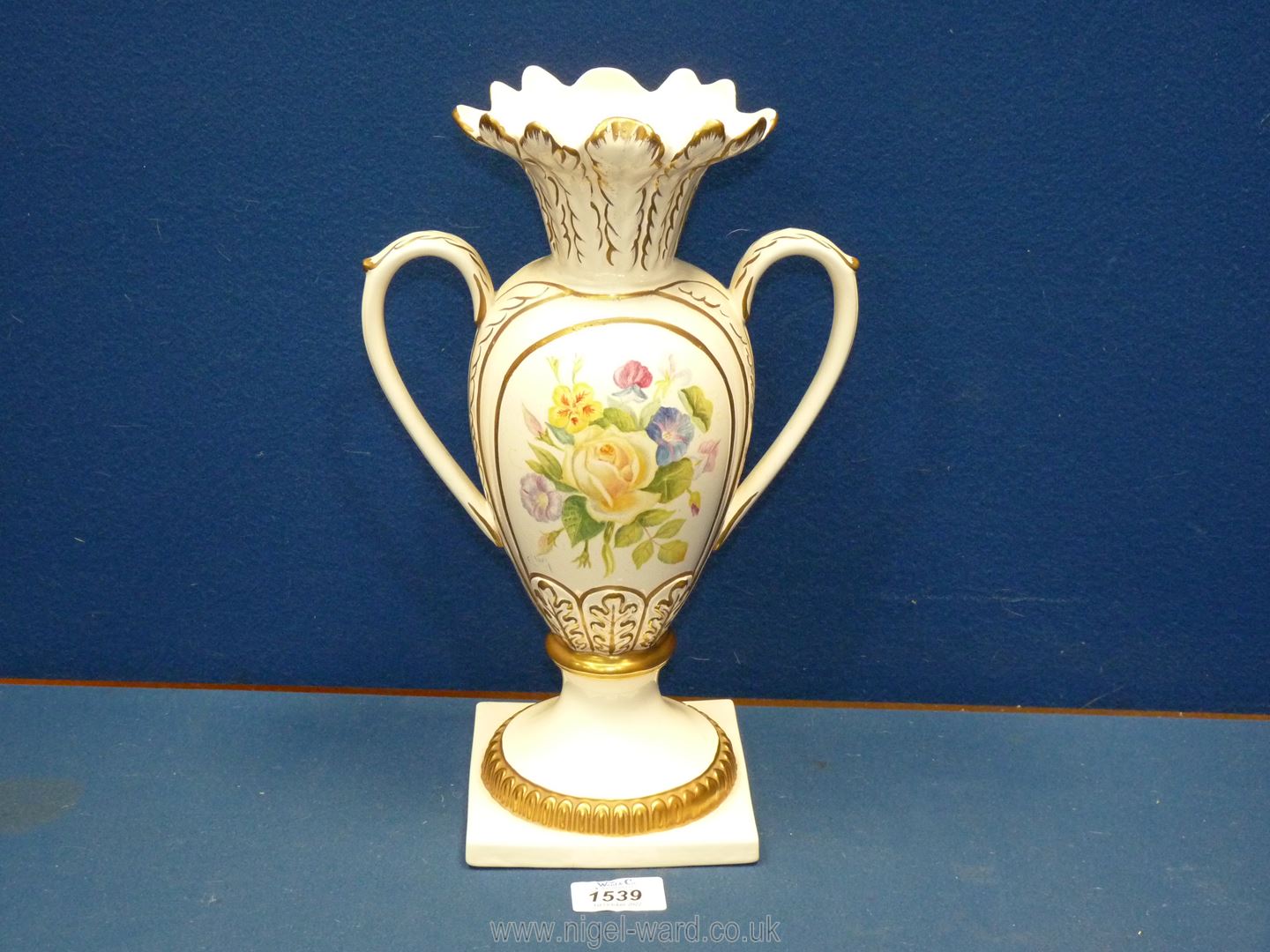 A cream ground Royal Creamware hand painted vase by F. Clarke (ex Royal Worcester painted/worker.