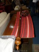 A circa 1900 Mahogany curtain Pole having intricately turned end finials and complete with a pair