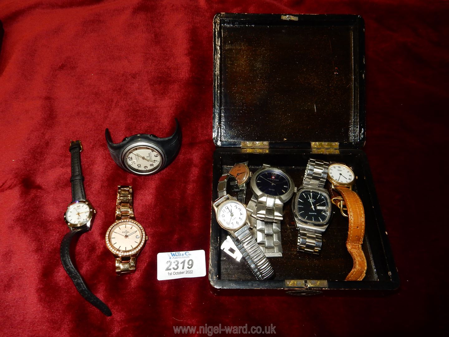 A box of mixed watches.