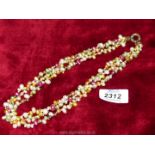 A multi-coloured seed pearl necklace.