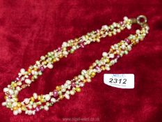 A multi-coloured seed pearl necklace.