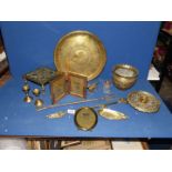 A quantity of brass including detailed brass pot, photo frames, tray, fire pokers, dog, etc.