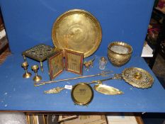 A quantity of brass including detailed brass pot, photo frames, tray, fire pokers, dog, etc.