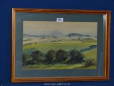 A wooden framed watercolour, title written verso 'The Skirrid from The Wigga',