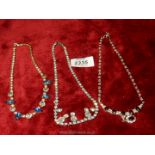 Three vintage costume jewellery necklaces.