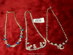 Three vintage costume jewellery necklaces.