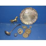 A circular epns tray, ladle, brass horse, door knocker, horse brasses, etc,