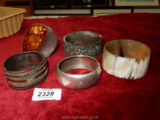 An unusual cuff bangle marked 925 with amber coloured stone, plus two white metal bangles,