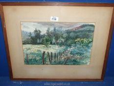 A framed and mounted Watercolour depicting a country landscape, no visible signature.