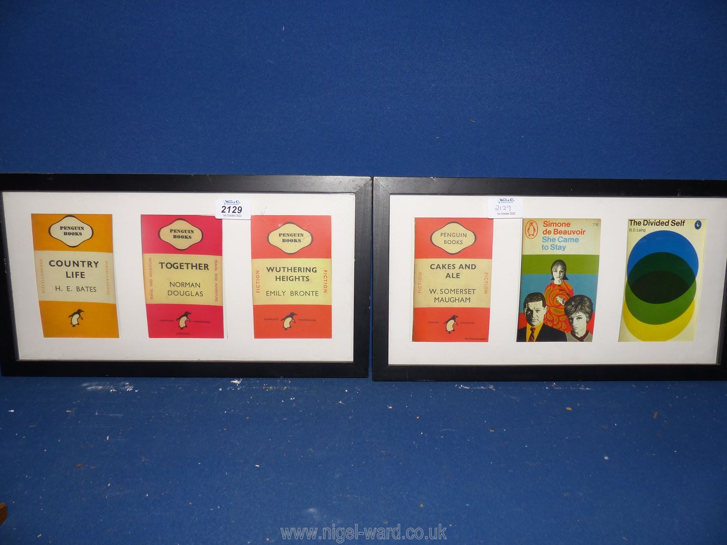 Two modern frames containing three prints taken from Penguin Book covers.