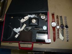 A quantity of watches and straps including Sekonda etc, in red briefcase.