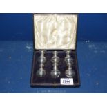 A cased set of six Silver pepper Pots, hallmarked 1909 by Edward Bernard & Sons.