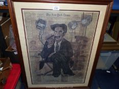 A wooden framed Print of the New York Times 1922 with a drawing of Julius Henry "Groucho" Marx sat