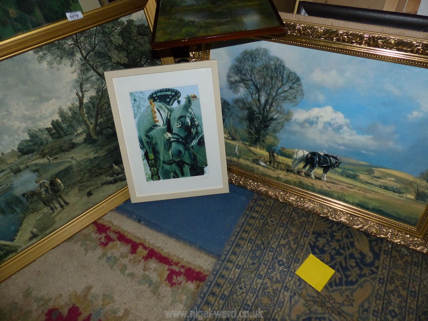 A quantity of prints to include; an over varnished wooden print titled 'Setting the Plough',