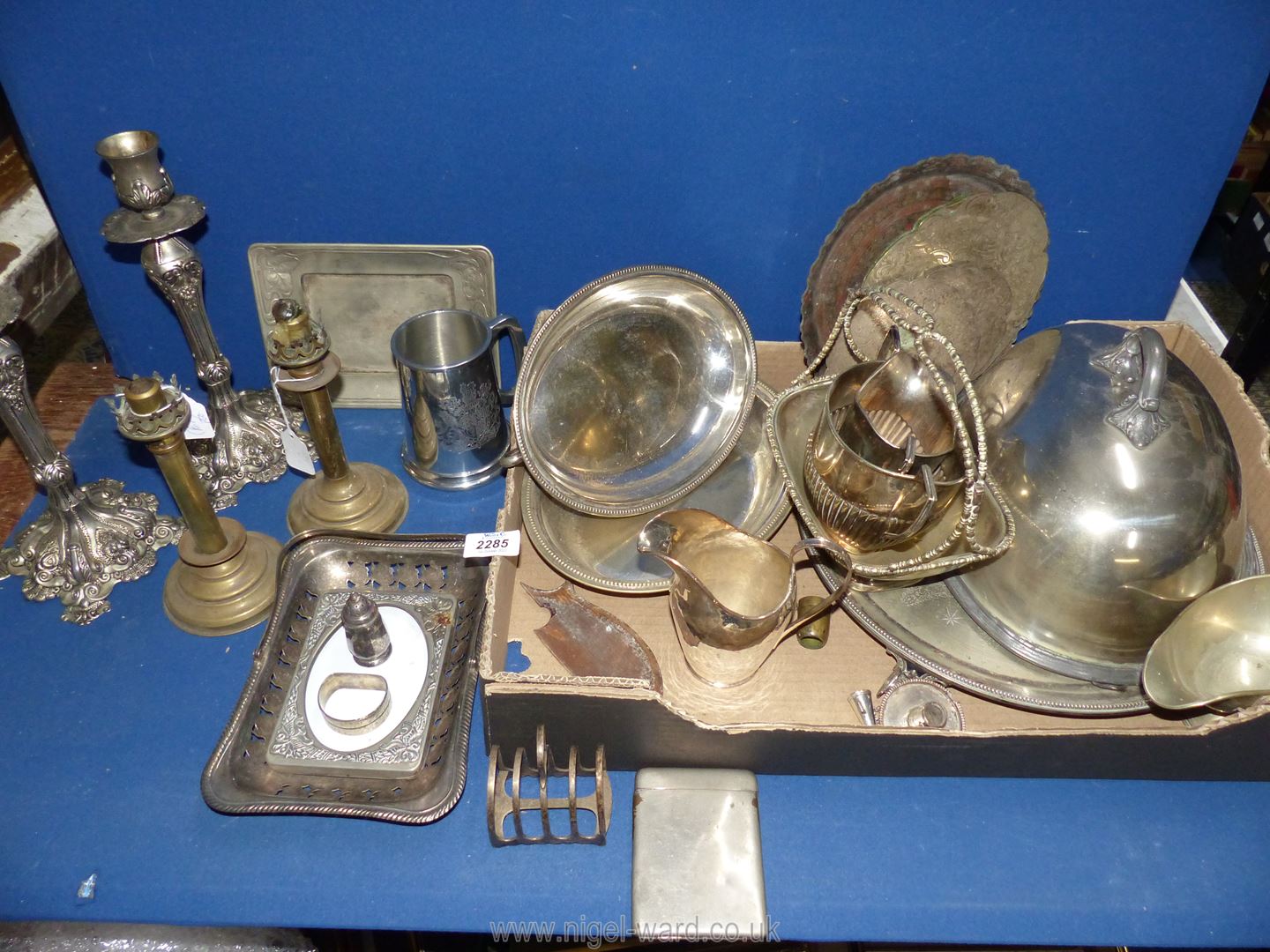 A quantity of plate and EPNS items including candlesticks, sauce boat, toast rack, tankard, etc.