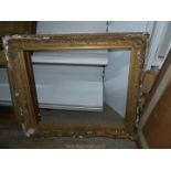 A large picture Frame, with loss to plaster decoration, 37½" x 32", aperture size 30¼" x 25½".