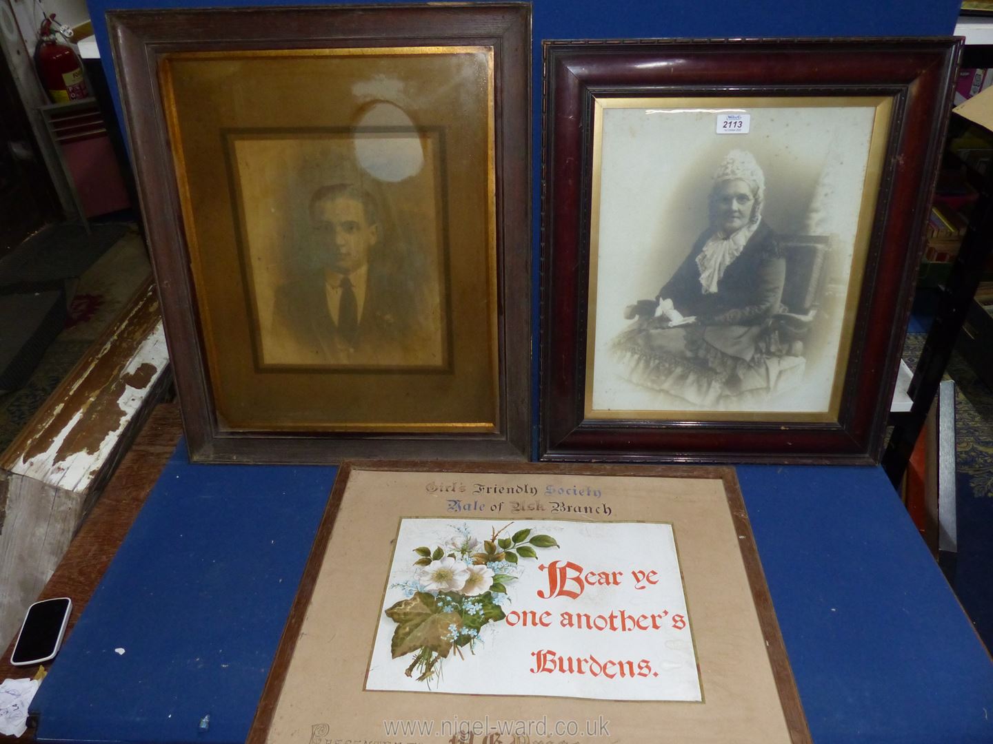 Two wooden framed Prints taken from photographs depicting a gentleman and an elderly lady,
