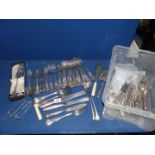 A large quantity of plated kings pattern cutlery including dinner forks, fish knives and forks,