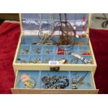 A jewellery box and contents including earrings, pairs of cufflinks, brooches, necklaces, etc.