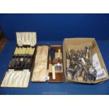 A quantity of epns and other plated cutlery including a boxed set of fish knives, carving set,