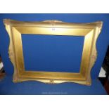 A gilt picture frame, (some damage to the plaster), 29½" x 22½" frame aperture size 21¼" x 14¼".